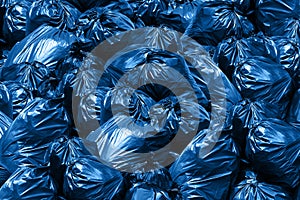 Background Garbage pile of trash bags, blue Bin,Trash, Garbage, Rubbish, Plastic Bags pile