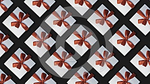 Background with gifts. White gift boxes with red ribbons on a black background.