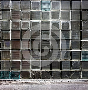 background of glass square tile wall with broken pieces