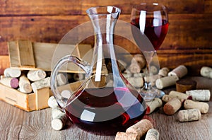 Background with glass of wine, decanter and corks