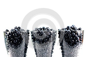 Background of glasses of bilberry