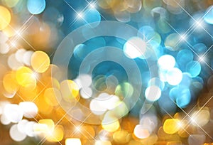 Background gold with blue glowing sequins,Zolotoy and sparkling blue glitter,blurred festive background,