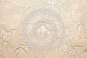 Background of gold wall with cracked texture.