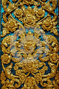 Background with golden flowers and blue mosaic