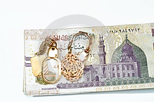Background of golden keyring medals made of gold karat 18 with Arabic text Allahu Akbar translation (God is the greatest