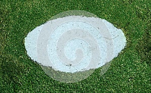 Background, grass through slab on the pavement.