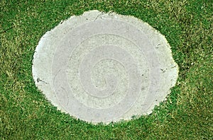 Background, grass through slab on the pavement.