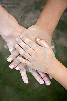 Background of hands of asian female adult and two kids group tog