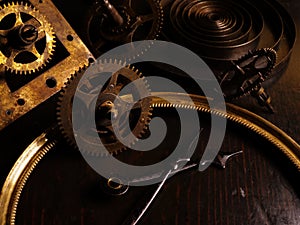Background from The hands of an old vintage watch, spring and gears