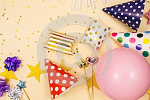 Background for happy birthday celebration or party. Group of colored balloons, confetti, candles, ribbons