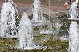 Background from homogeneous fountains on a clear sunny day photo