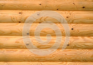 Background of horizontal hewed painted wooden logs
