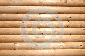 Background of horizontal hewed wooden logs