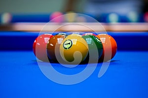 Background image of Billiard balls in a blue pool table