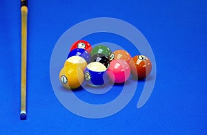 Background image of Billiard balls in a blue pool table