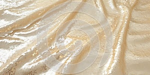 Background image of cream-colored fabric with sequins