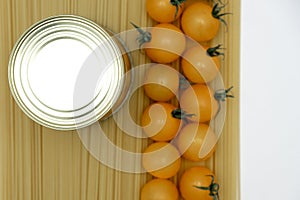 The background image of the food supplies quarantine food crisis  on white. Macaroni, canned food, tomatoes