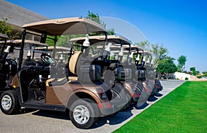 Background image of Golf carts parked on a golf closure in a line