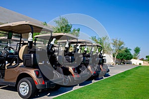 Background image of Golf carts parked on a golf closure in a line