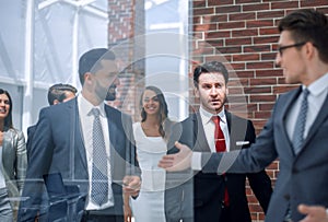 Background image of a group of business people standing in the office