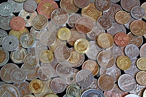 Background image made up of coins of different countries and continents. Scattering of coins from different countries