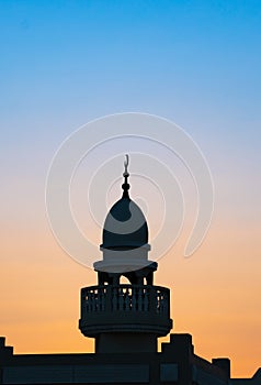 Background image of mosque minaret during sunset