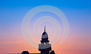 Background image of mosque minaret during sunset