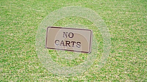 Background image of no carts sign board on a golf course