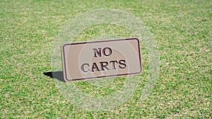 Background image of no carts sign board on a golf course