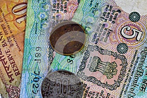 Background image of old Indian currency notes and coins