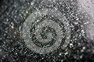 Background image of rain drops on a glass window. Macro photo with shallow depth of fiel