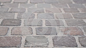 Background image of set of granite Grey brick stone street road. Light sidewalk, pavement texture