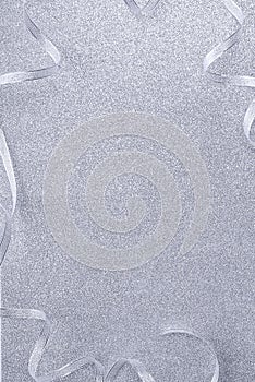 Background image in silver tone, ribbon on sparkling background