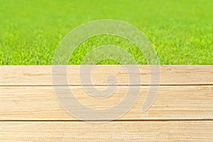 Background image of wooden planks and green grass