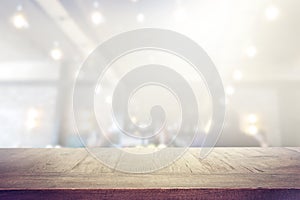 Background Image of wooden table in front of abstract blurred lights