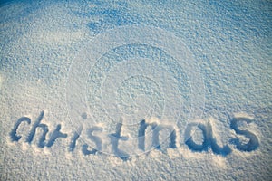 Background from inscription Christmas on snow