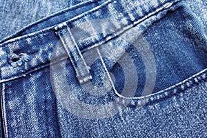 Background jeans, blue denim texture fabric with a seam of fashionable design. Empty pattern copy space