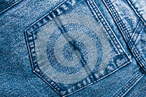 Background jeans, blue denim texture fabric with a seam of fashionable design. Empty pattern copy space