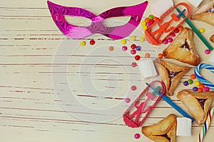 Background for Jewish holiday Purim with mask and hamantaschen cookies