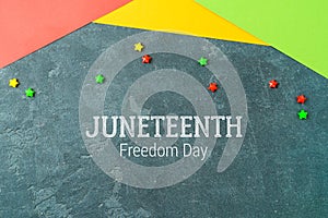 Background for Juneteenth holiday day with colorful paper photo