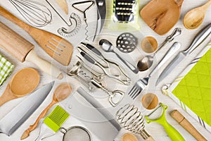 Background of kitchen utensils on wooden kitchen table