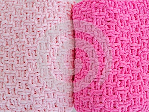 Background of knitted plaids. Pink and red