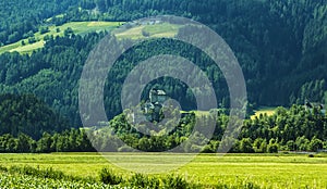 Background landscape view of aAncient castle among the fields in Tyrol
