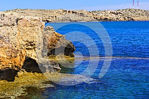 Background landscape view of the rocky coast in the reserve at Cape Capo Greco, Protaras