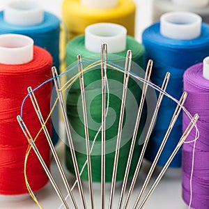 In the background, large spools of thread are organized in a