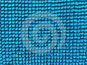 Background of light blue fabric close-up. Texture of blue microfiber background.