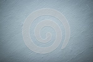 The background is a light gray color wall