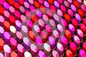 Background from lipsticks, lipstick background of different colors, 3D rendering