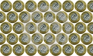 Background with a lot of Polish currency 2 PLN coins / Polish zloty. Isolated on a white background.