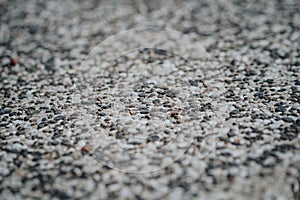 Background of a lot of stones close-up with focus in the center